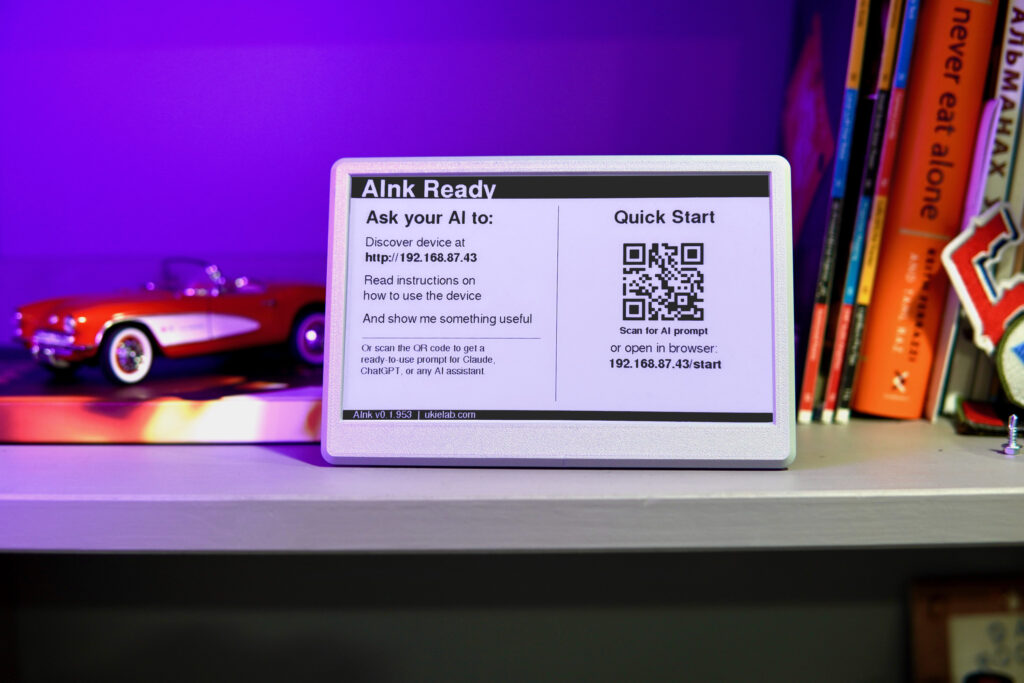 AInk e-ink display showing its setup screen with Wi-Fi and configuration QR codes